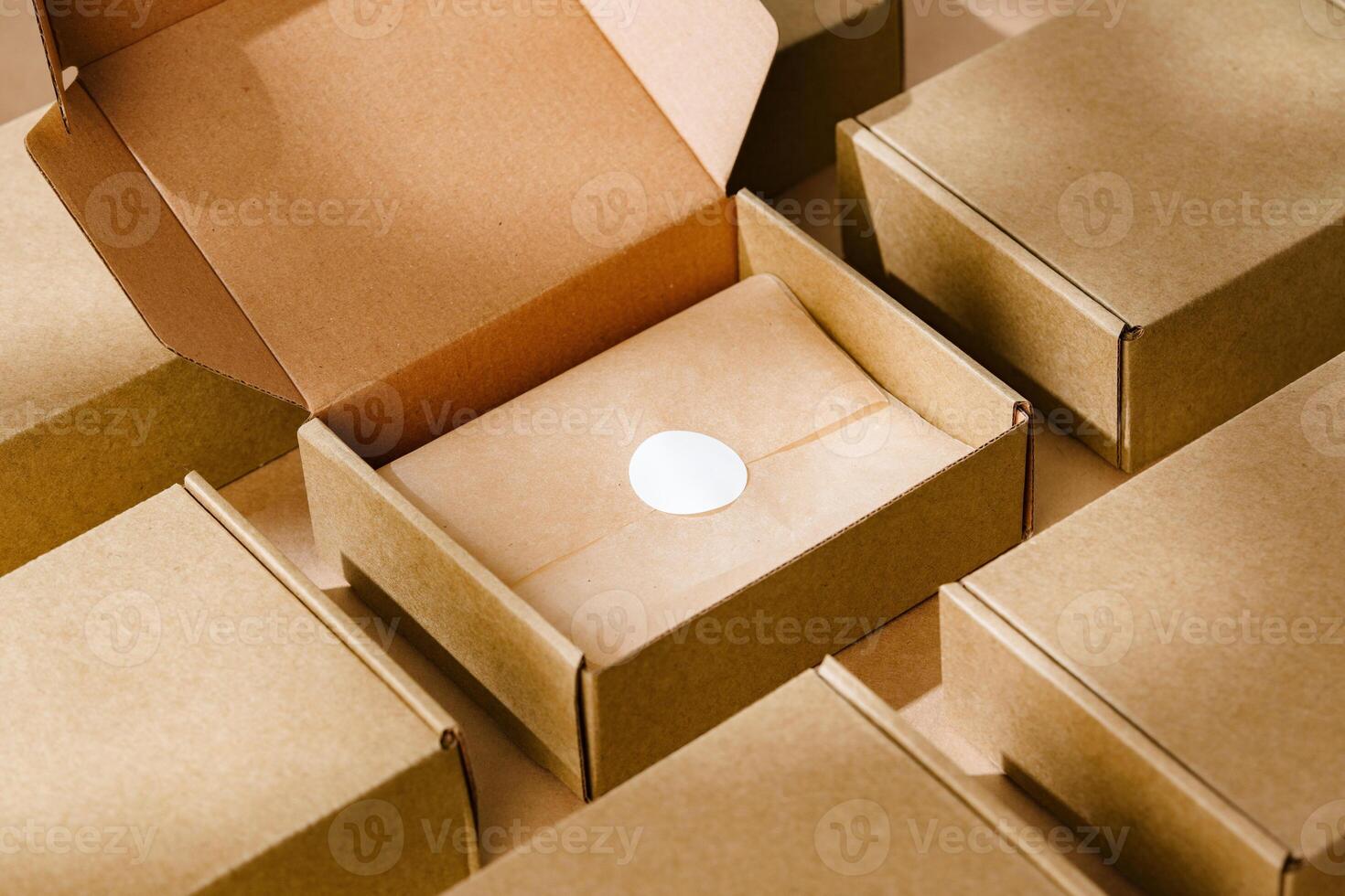Brown cardboard boxes arranged neatly on a workspace, showcasing packaging materials for shipping and storage activities photo