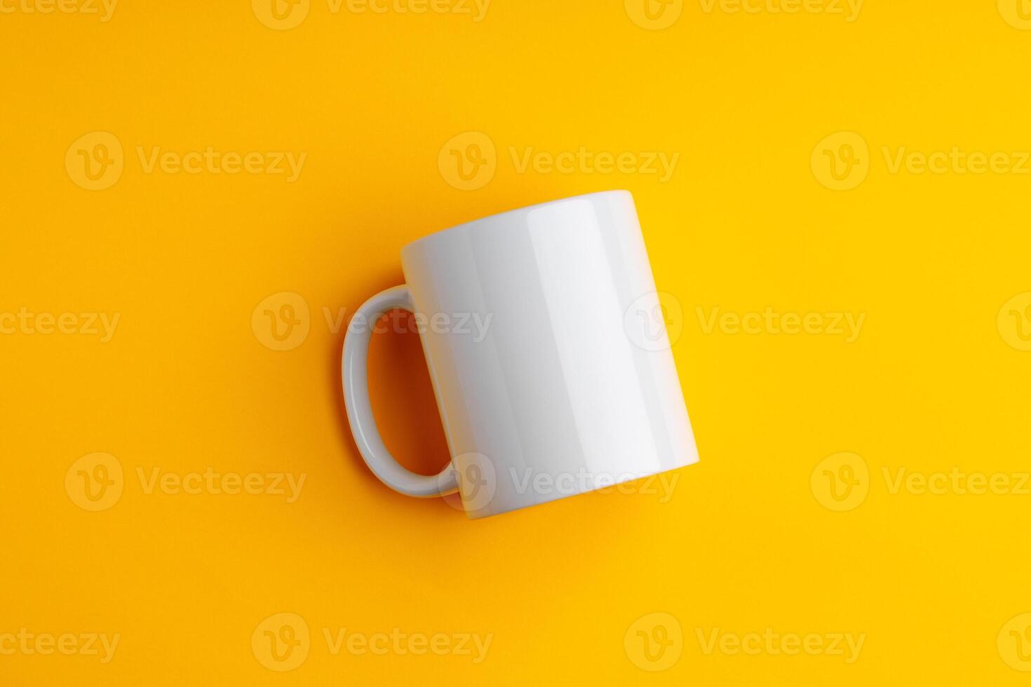 Ceramic mug on yellow studio background close up photo