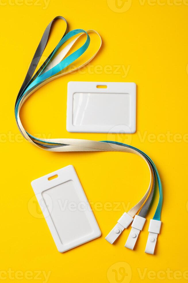 Blank badge with string on yellow background photo