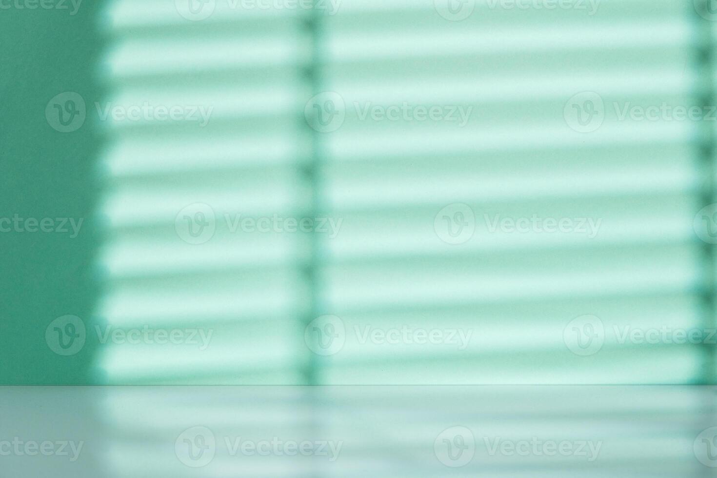 Mint blue wall with shadows for background photo