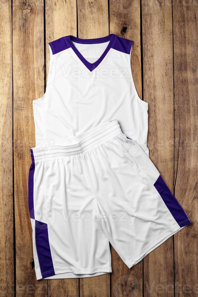 Basketball uniform on wooden background top view photo