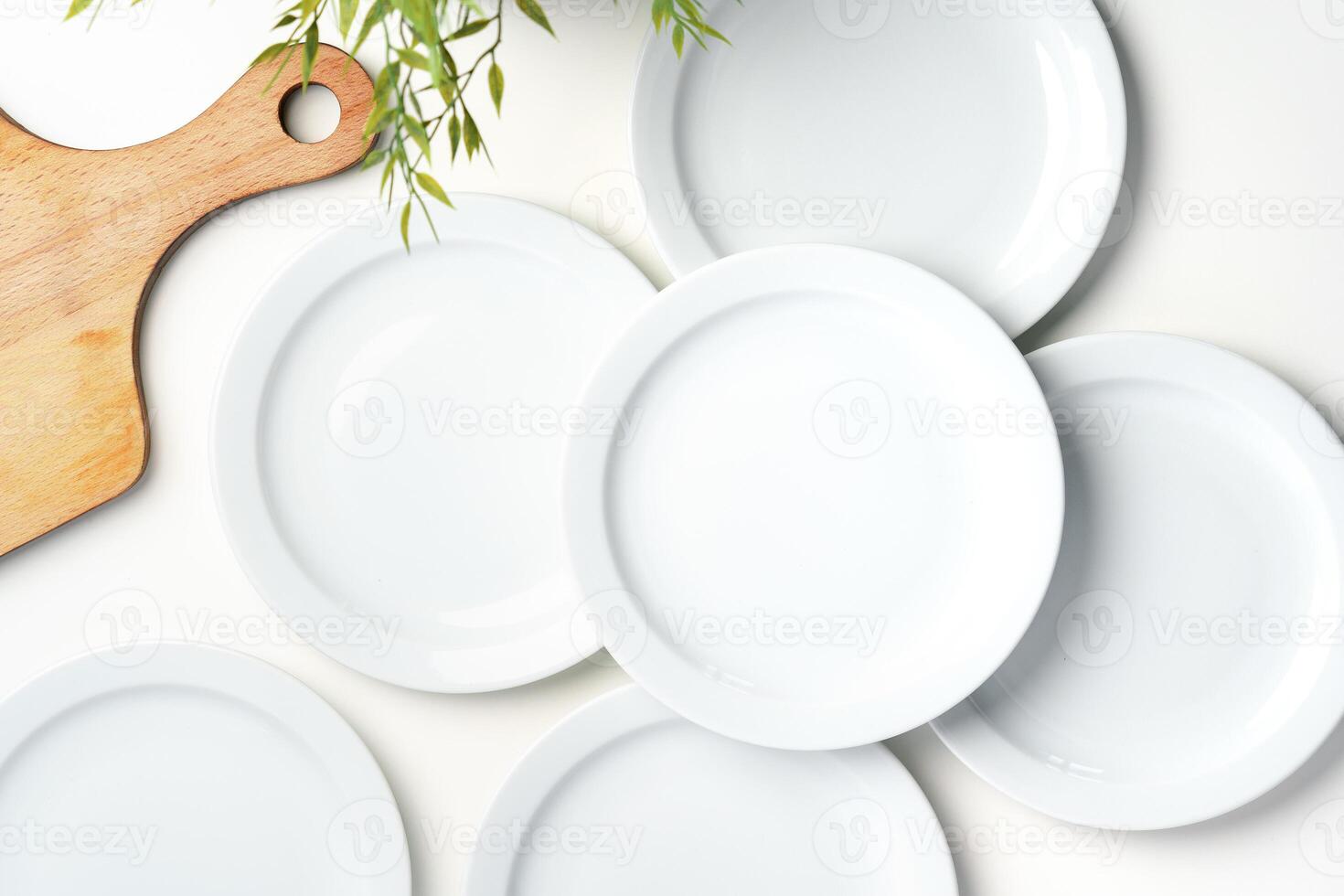 Set of white dinner plates on white background photo