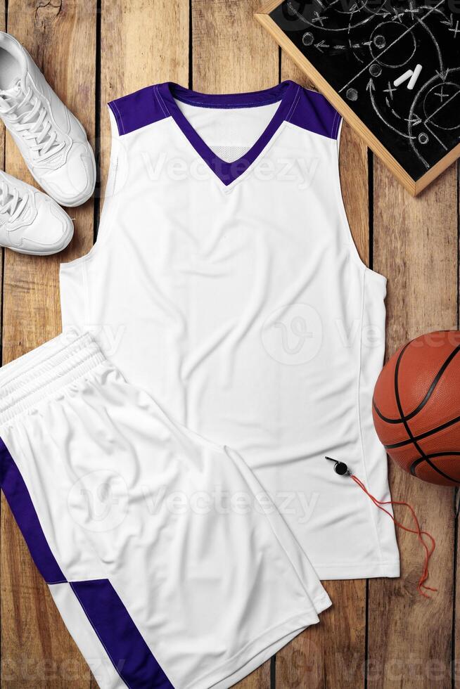 Basketball uniform on wooden background top view photo