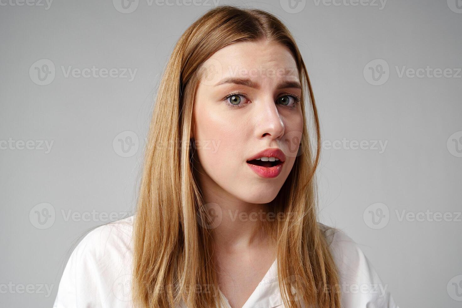 Young woman in a state of shock or surprise photo