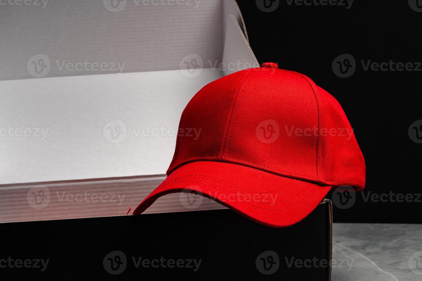 Baseball cap against black background studio shot photo