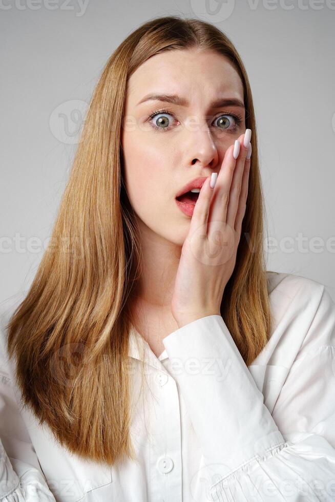 Young woman in a state of shock or surprise photo