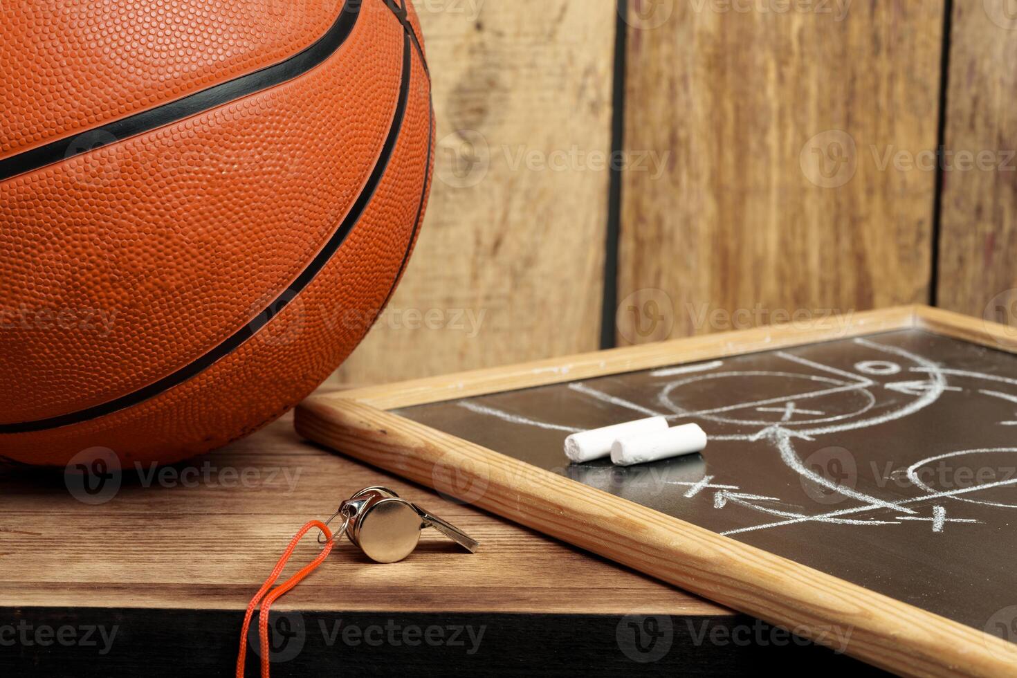 Basketball ball lying on a wooden floor photo