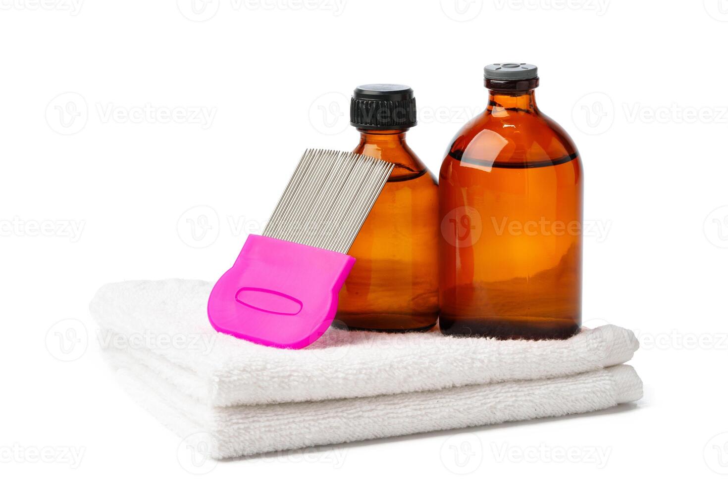 Comb, anti lice medicine and towel on white background photo