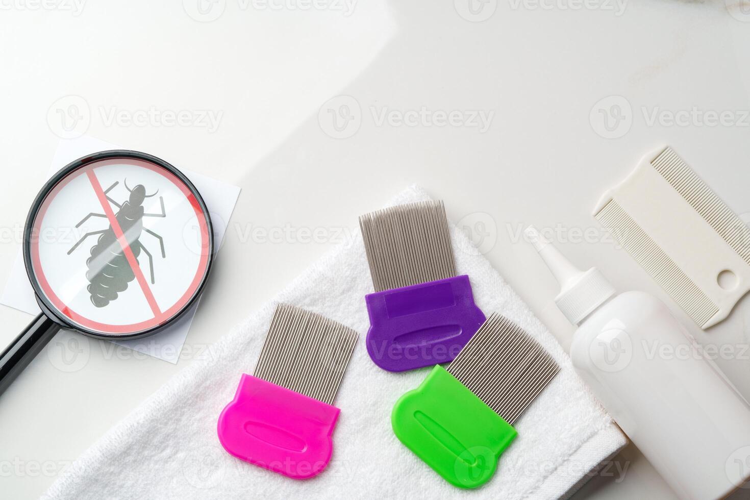 Comb, anti lice medicine and towel on white background photo