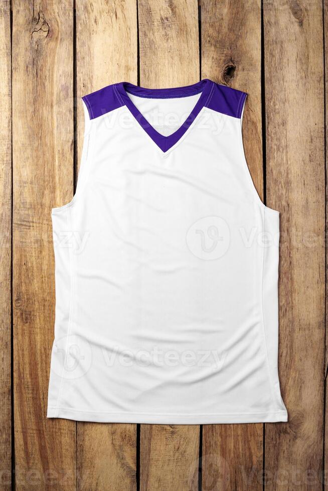 Basketball uniform on wooden background top view photo