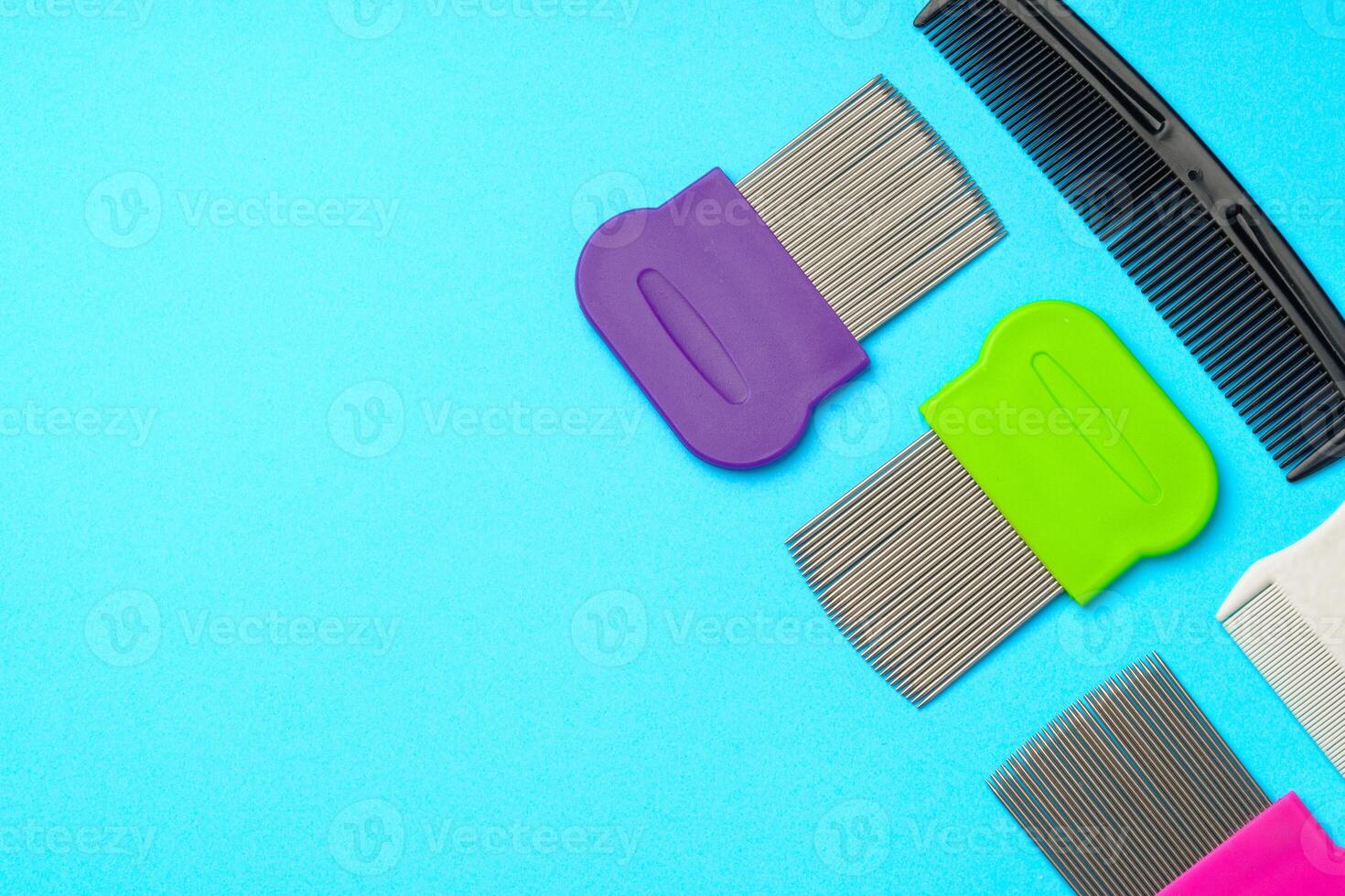 Comb for lice removing on blue background photo