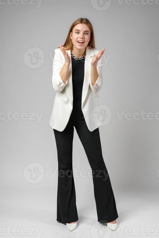 Excited Young Woman in Stylish Outfit Surprised Expression photo