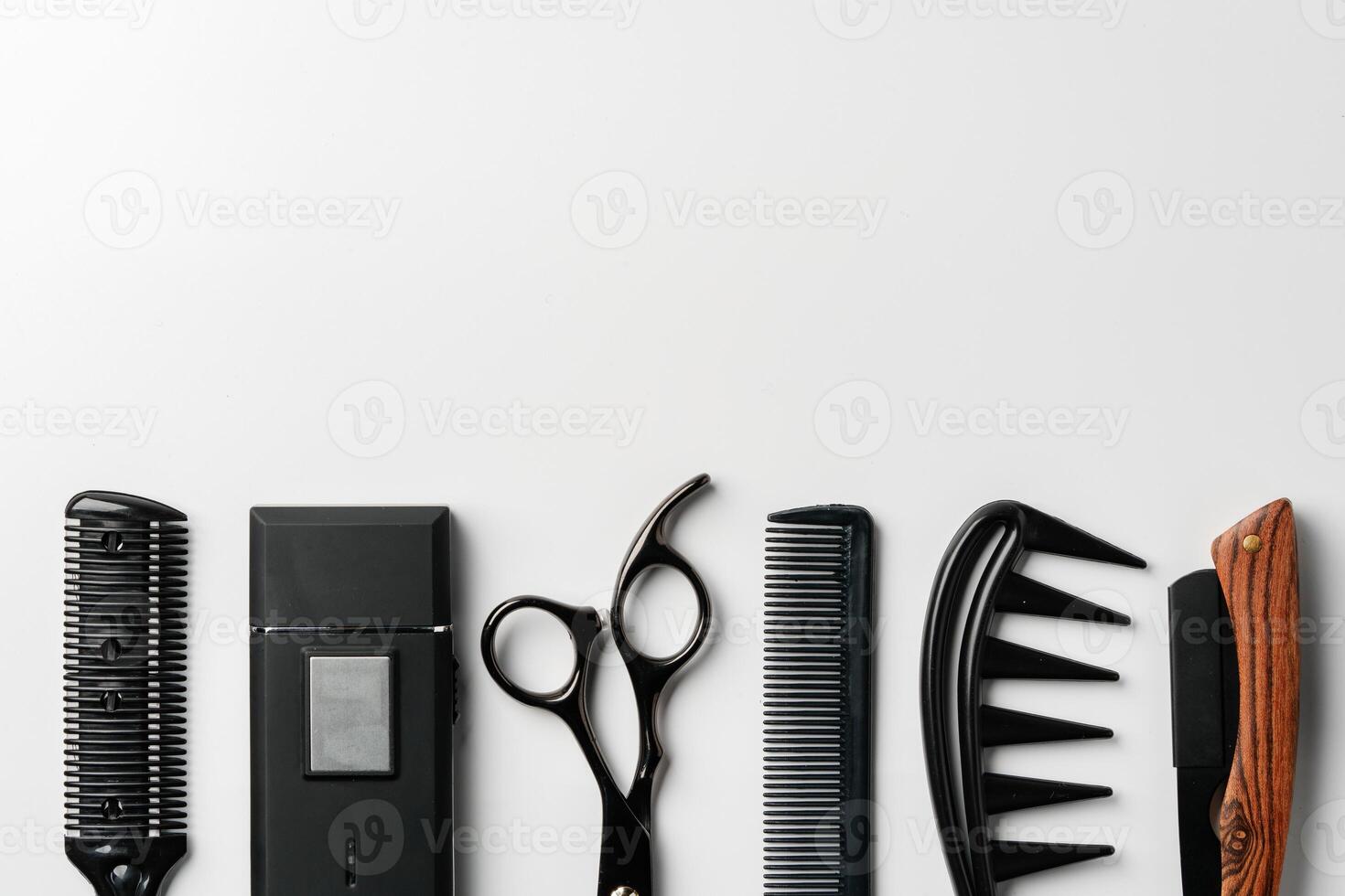Set of barber tools for haircut on gray background flat lay photo