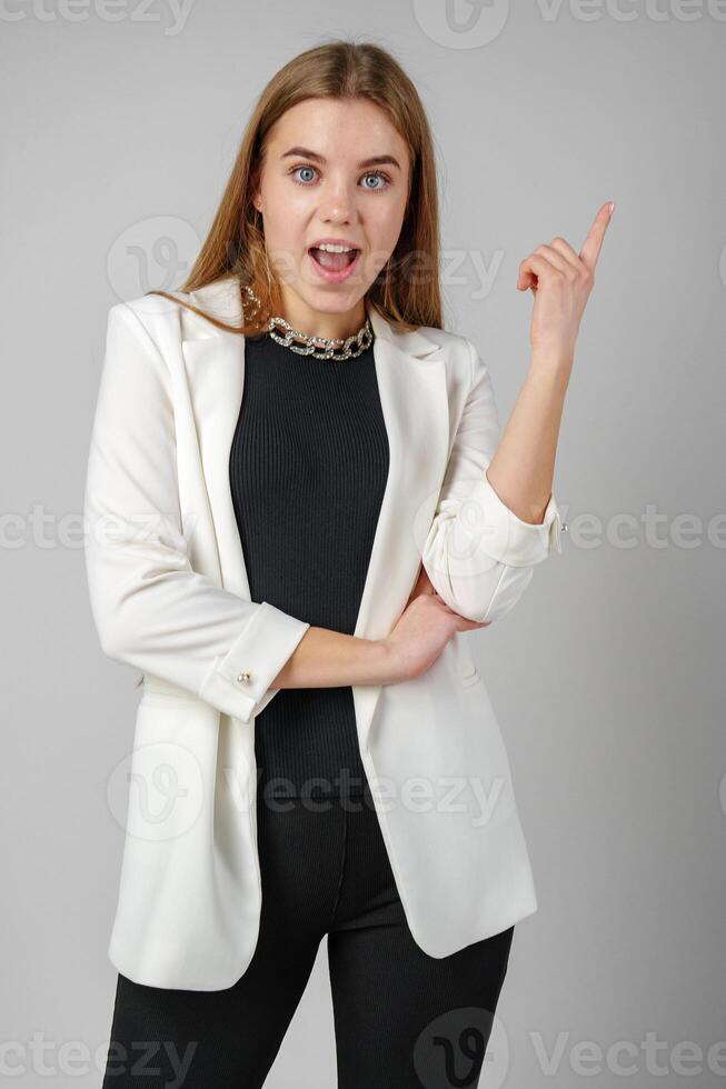Excited Young Woman in Stylish Outfit Surprised Expression photo