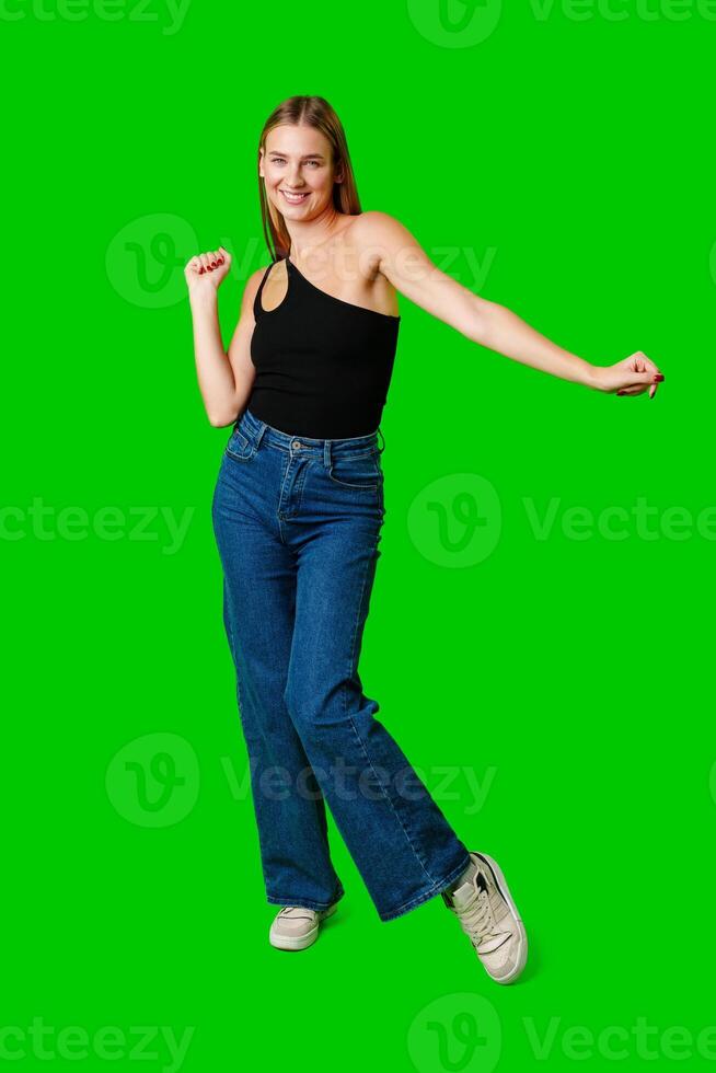 Young Woman Poses for Picture against green background. photo