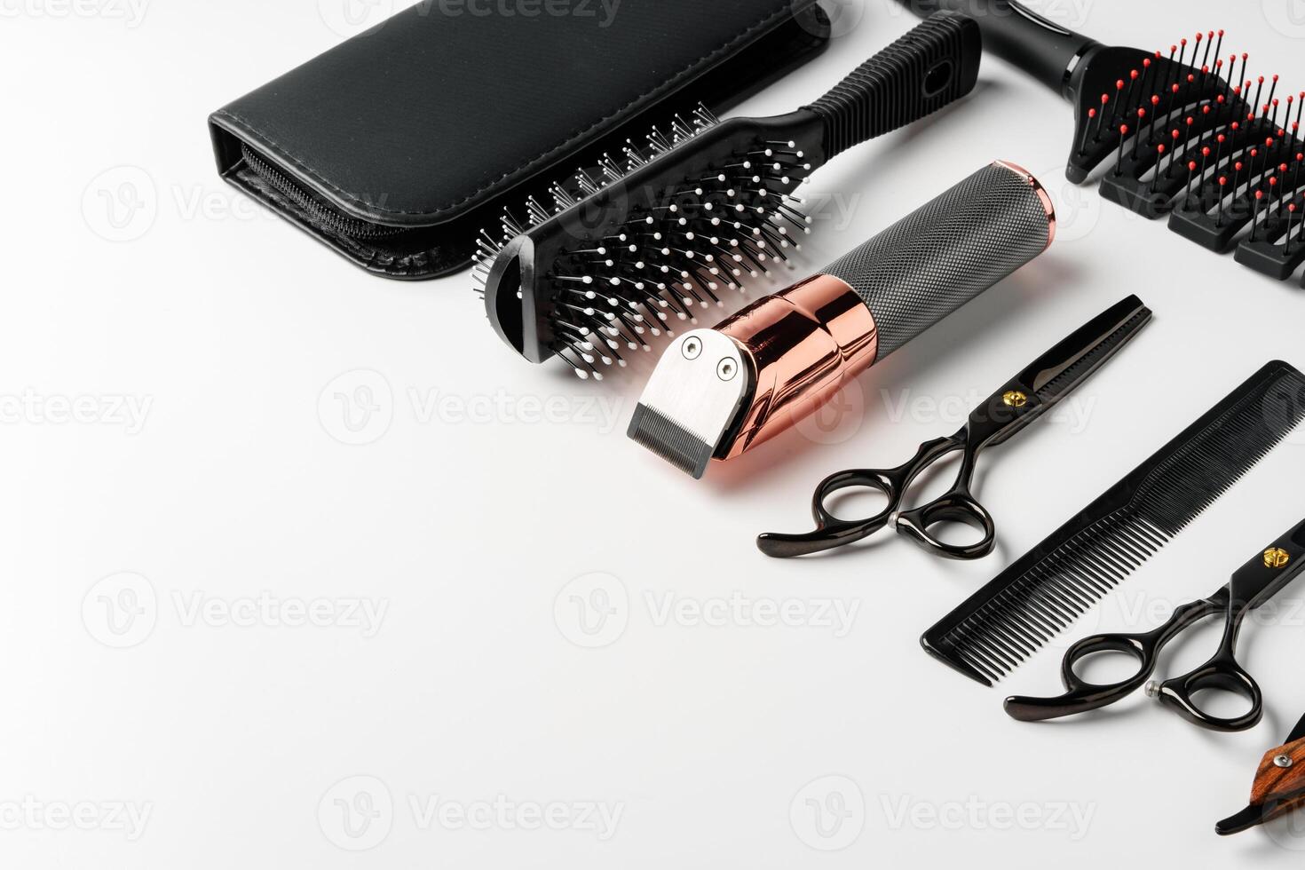 Set of barber tools for haircut on gray background flat lay photo