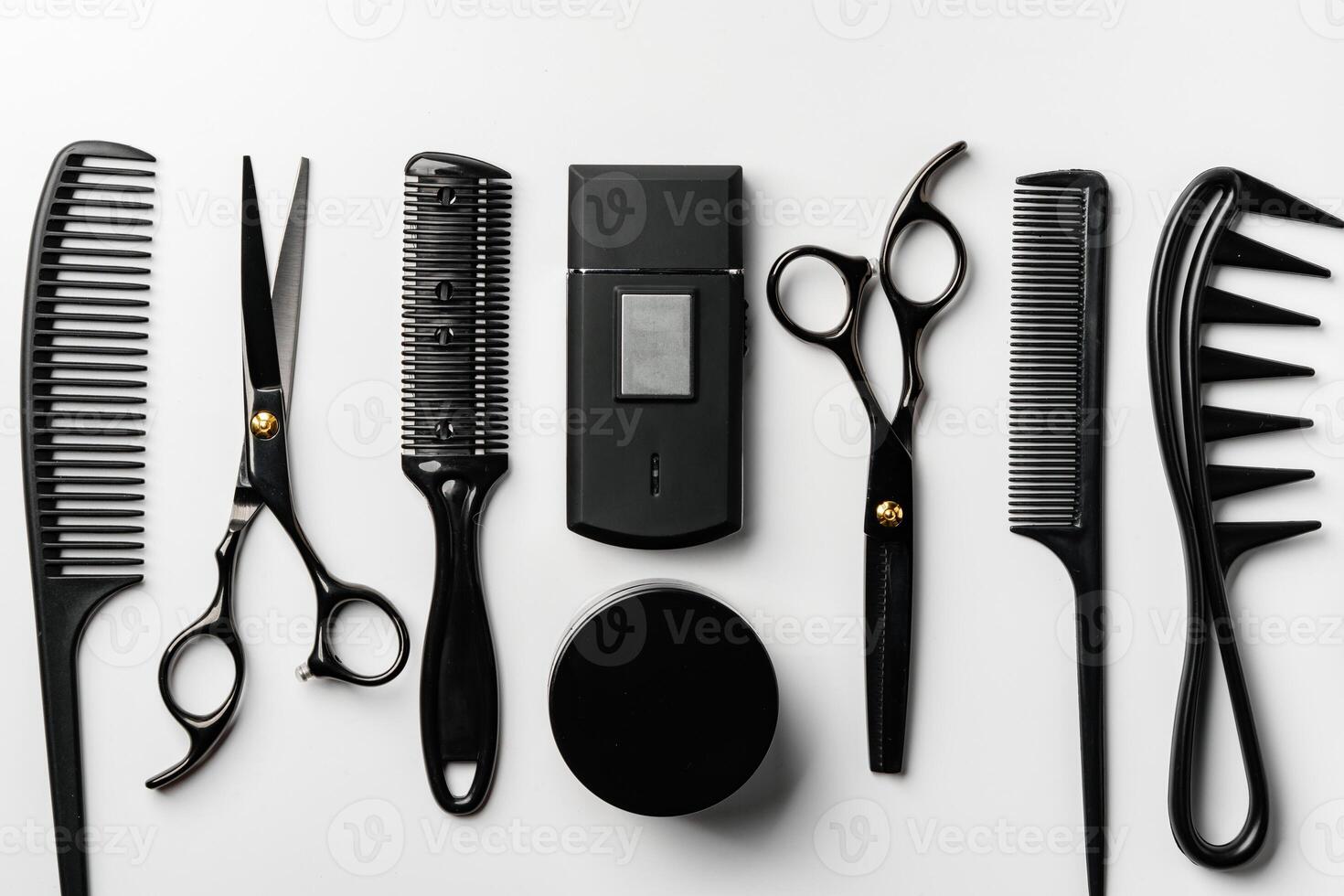 Set of barber tools for haircut on gray background flat lay photo