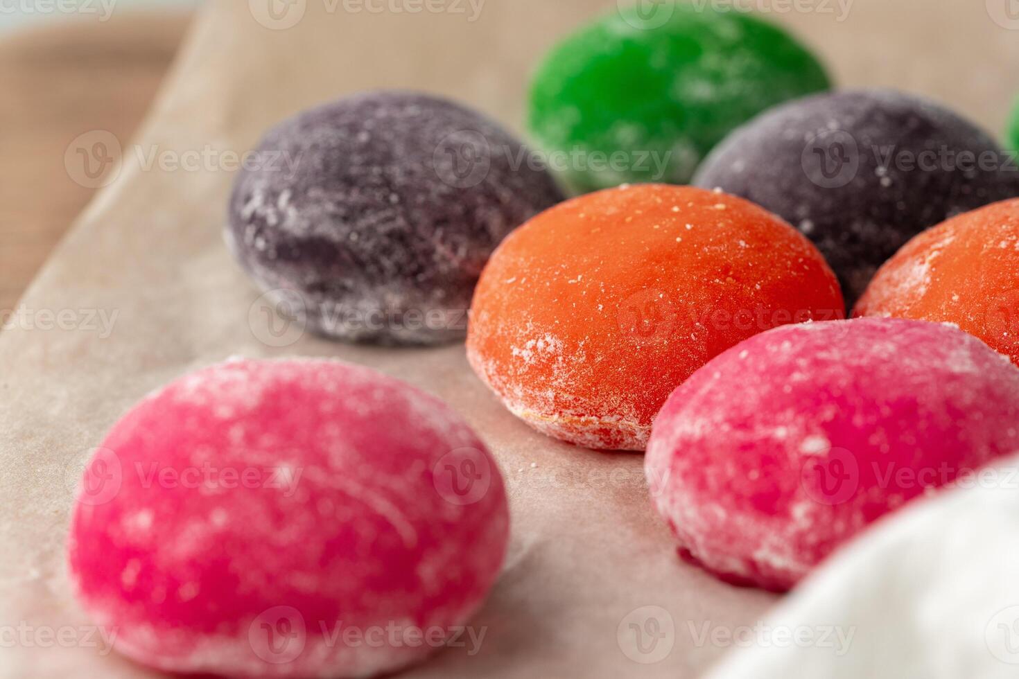 Multi-colored Japanese cakes Mochi in a white plate photo
