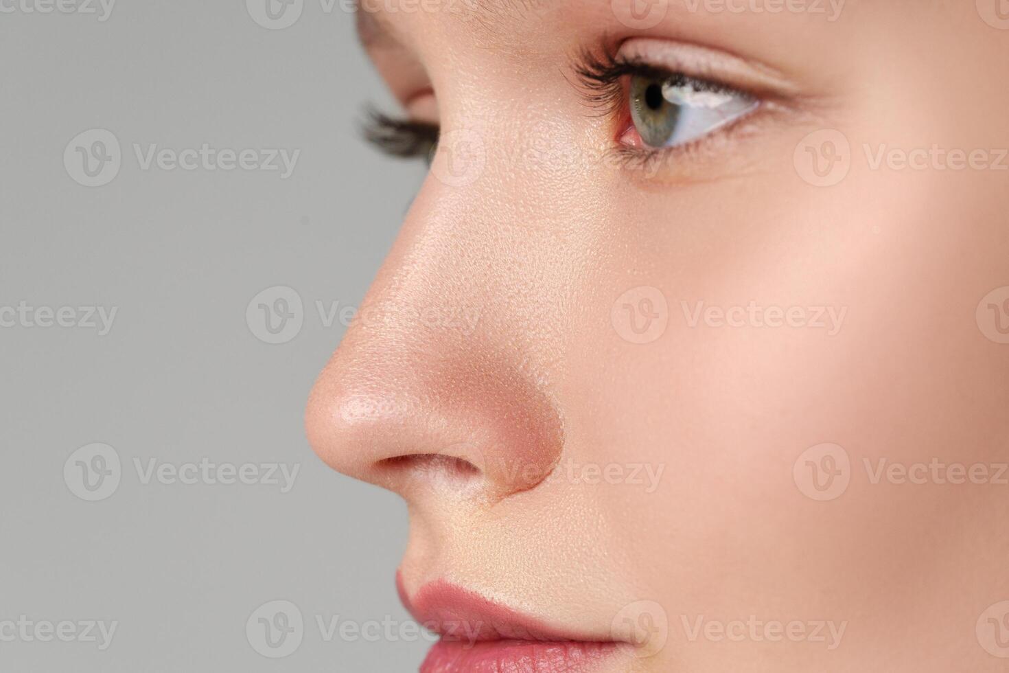 Close up of young female blue eyes photo