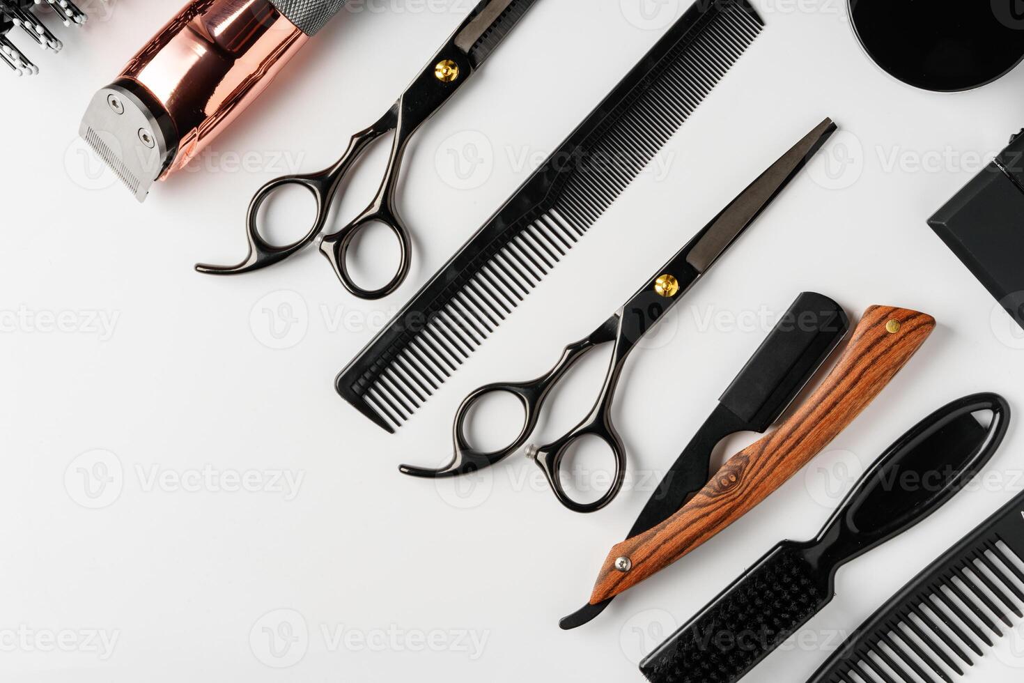 Set of barber tools for haircut on gray background flat lay photo