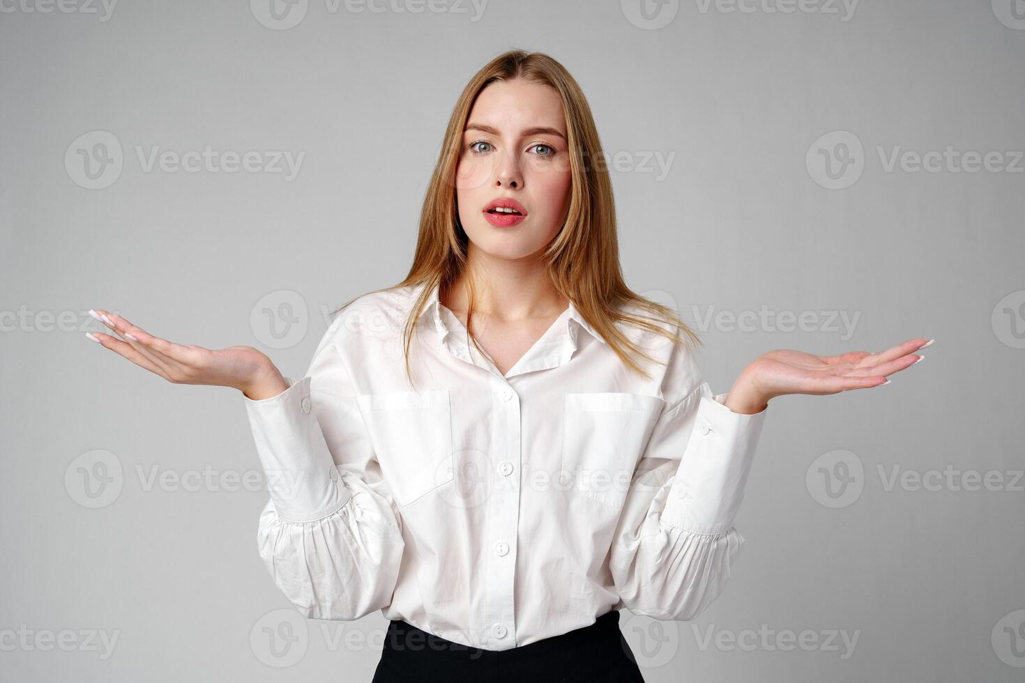 Woman in Formal Suit Holding Out Her Hands photo