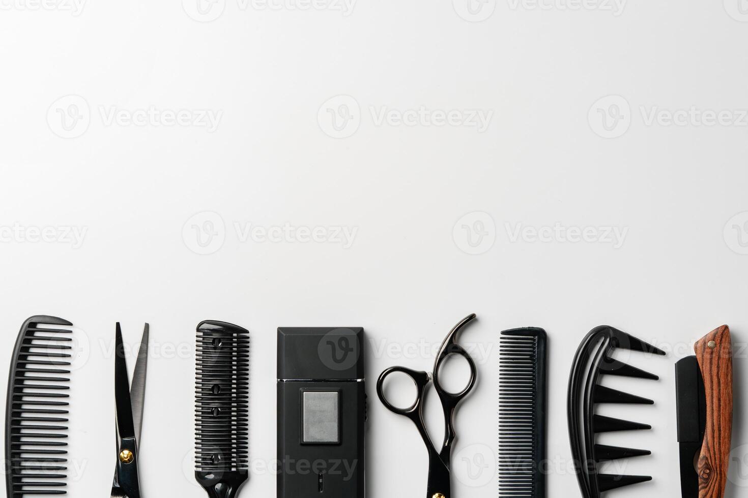 Set of barber tools for haircut on gray background flat lay photo