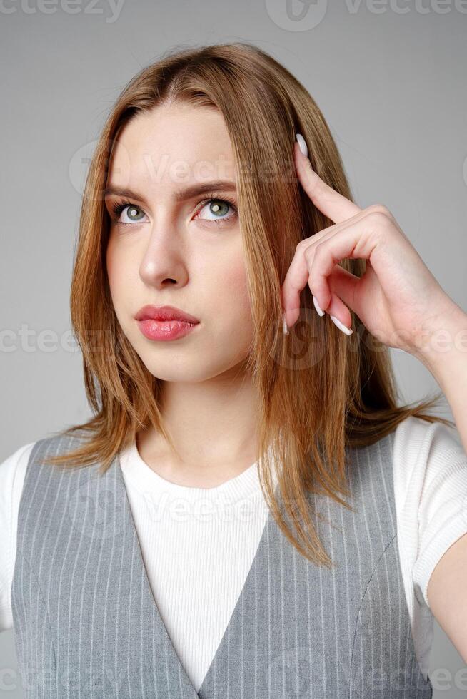 Concerned Young Woman deep in thought or contemplation photo