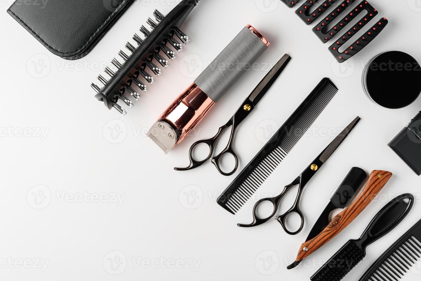Set of barber tools for haircut on gray background flat lay photo