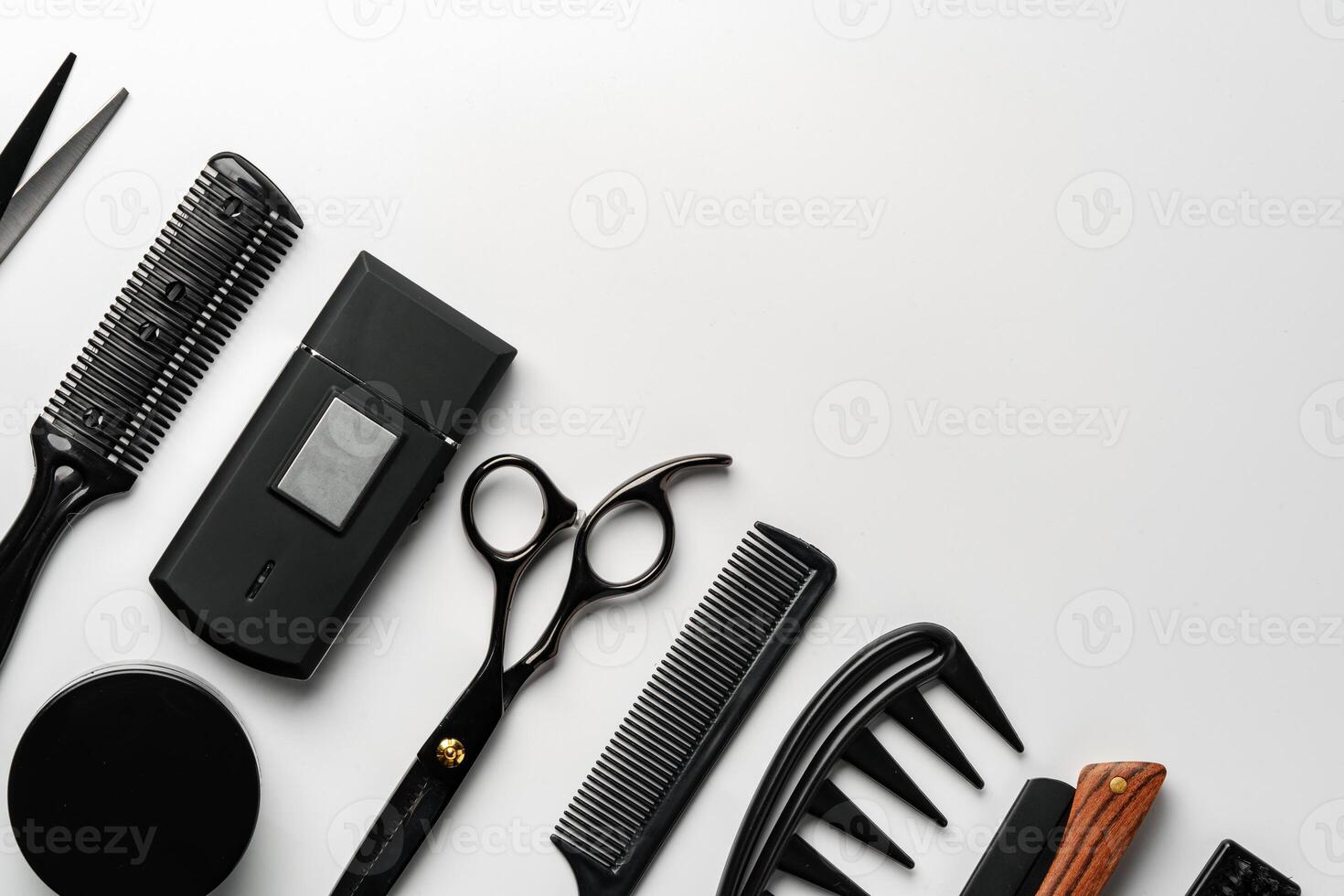 Set of barber tools for haircut on gray background flat lay photo