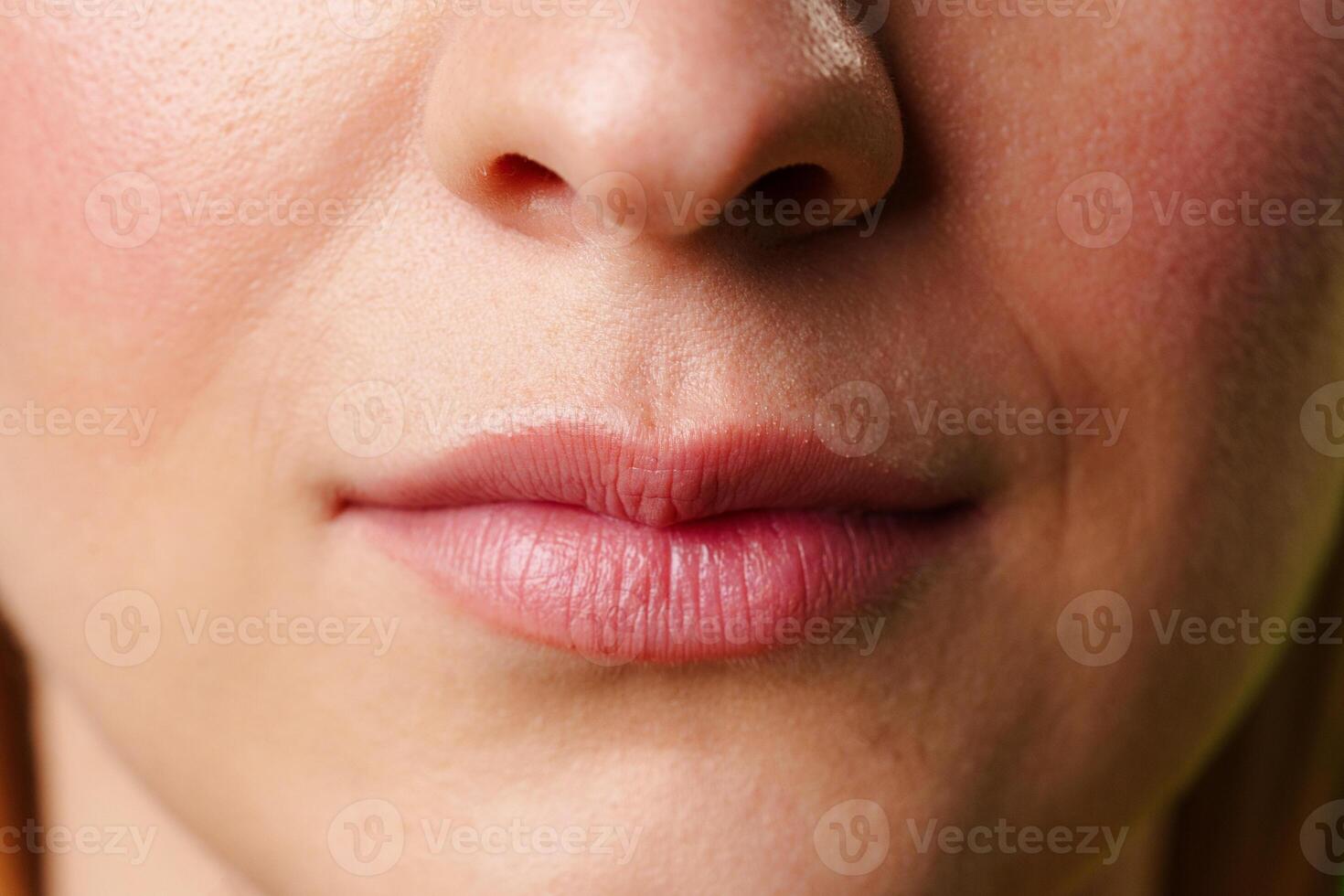 Close-Up of a Womans Lips and Nose With a Neutral Expression photo
