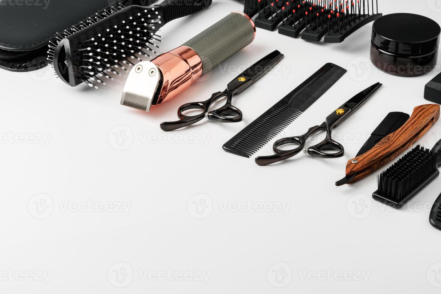 Set of barber tools for haircut on gray background flat lay photo