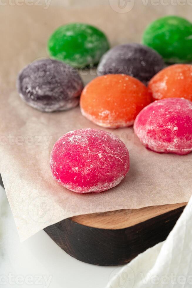 Multi-colored Japanese cakes Mochi in a white plate photo