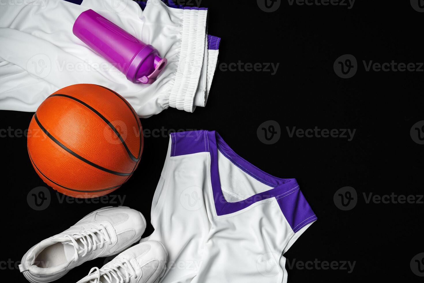 Basketball Gear Prepared for an Evening Training Session on a Dark Backdrop photo