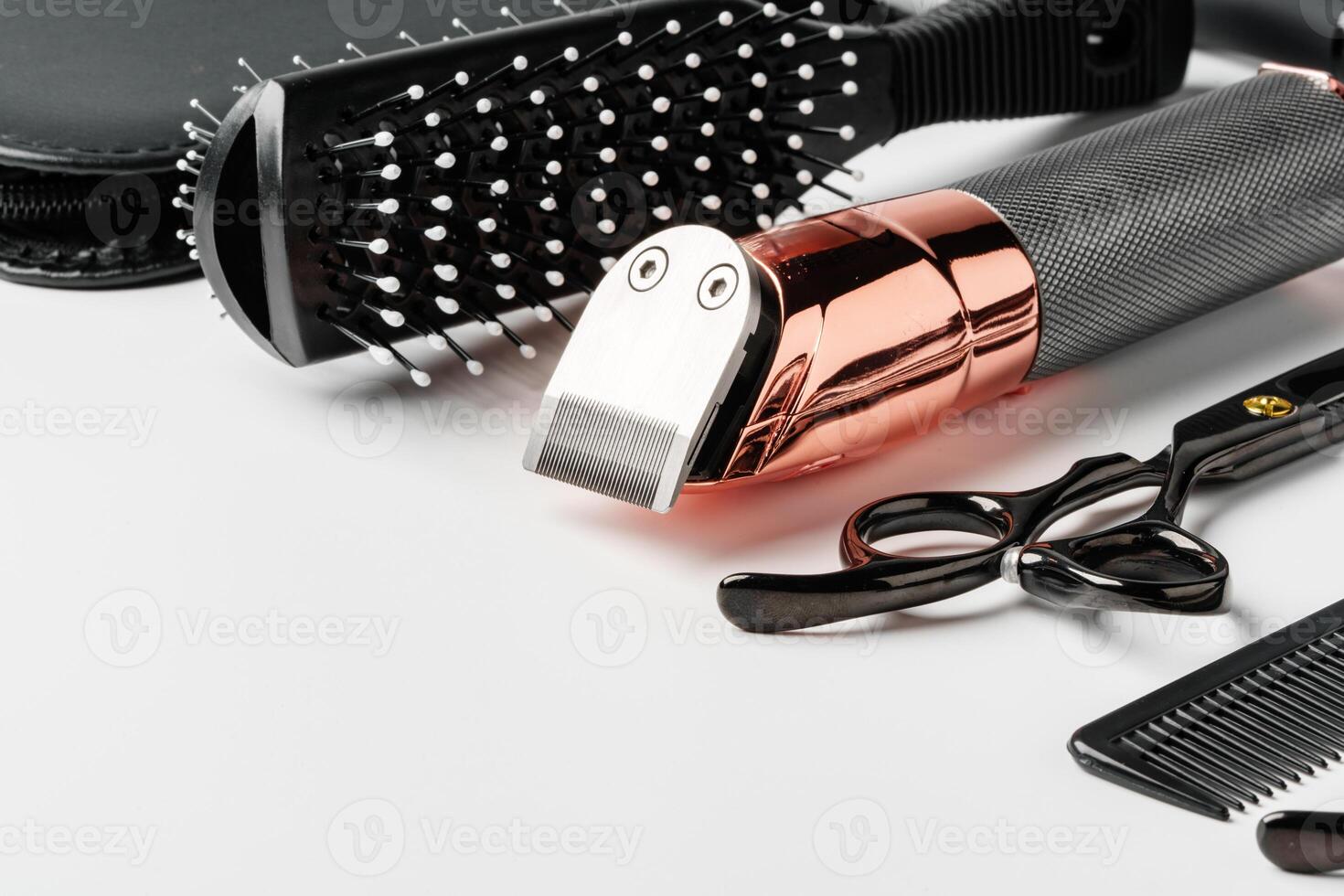Set of barber tools for haircut on gray background flat lay photo