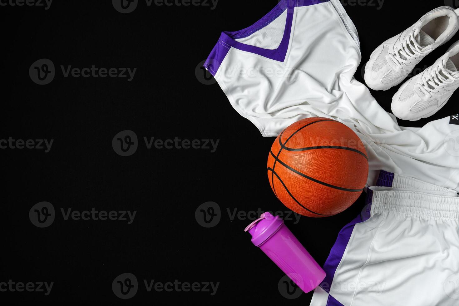 Basketball Gear Prepared for an Evening Training Session on a Dark Backdrop photo
