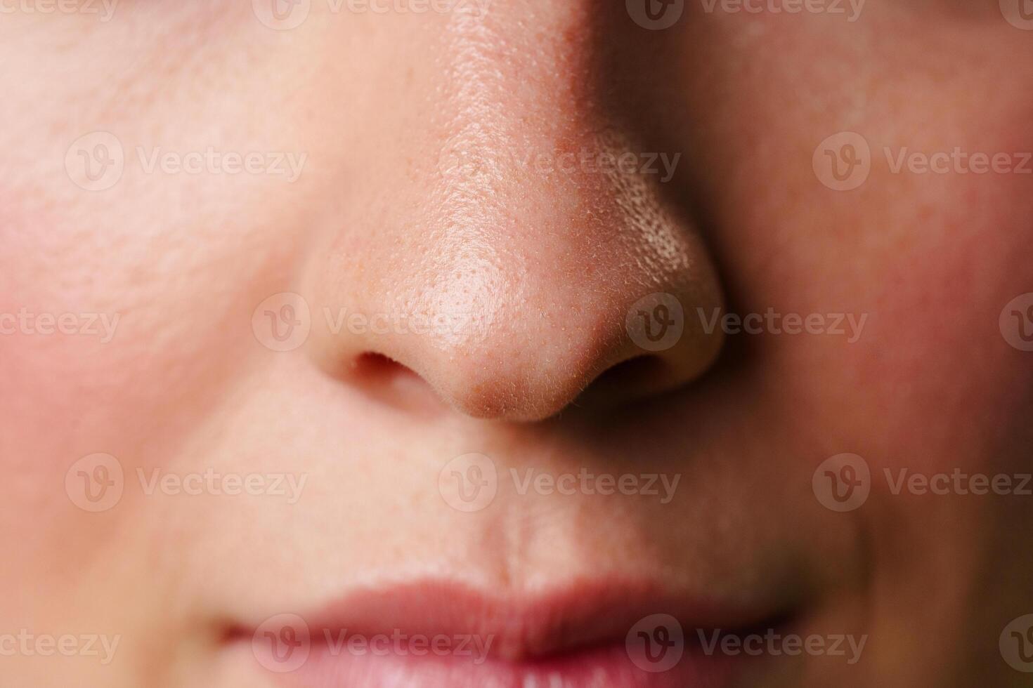 Close-Up of a Womans Lips and Nose With a Neutral Expression photo