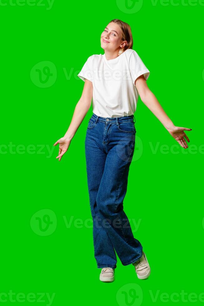 Young Woman Holding Out Hands against green background photo