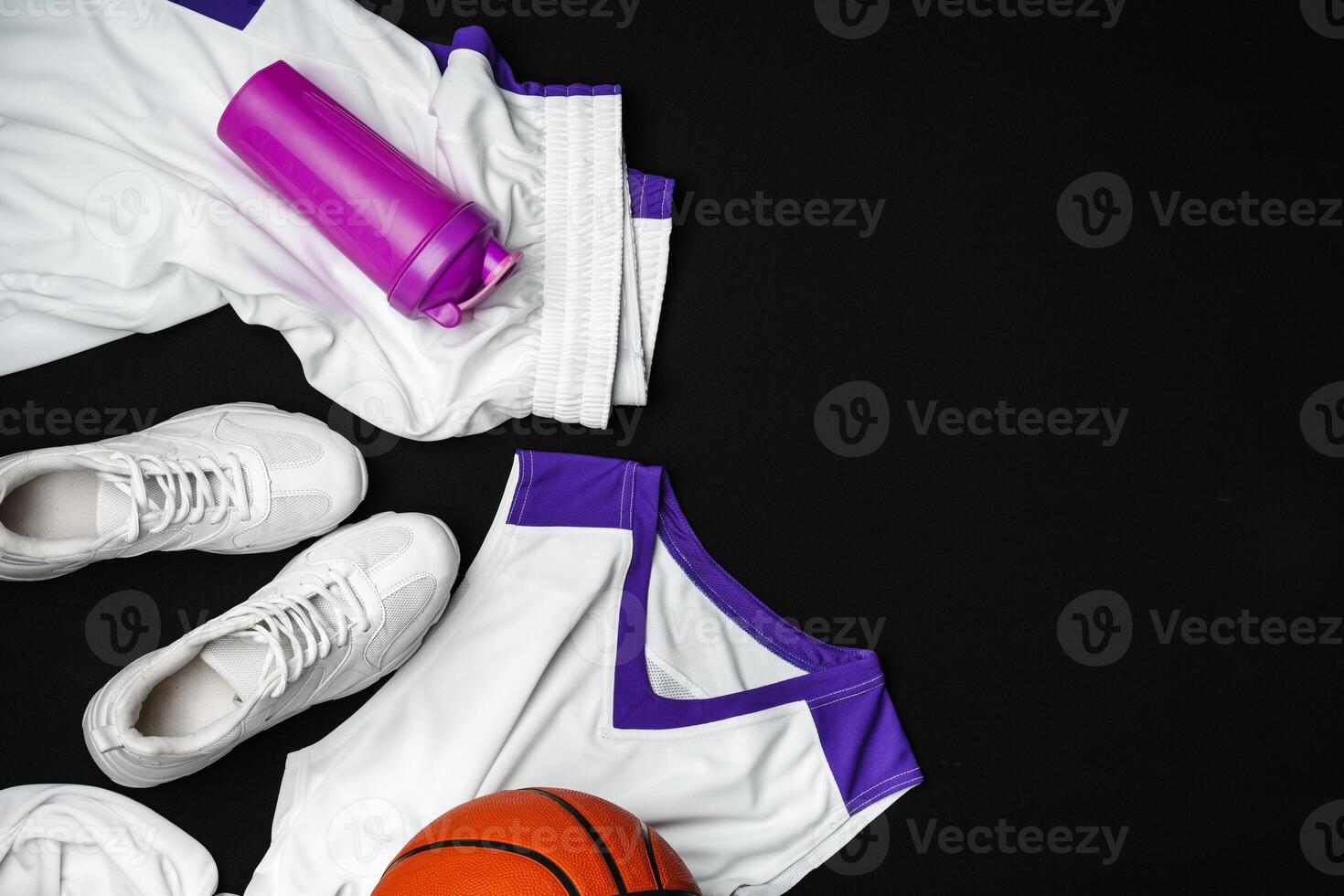 Basketball Gear Prepared for an Evening Training Session on a Dark Backdrop photo