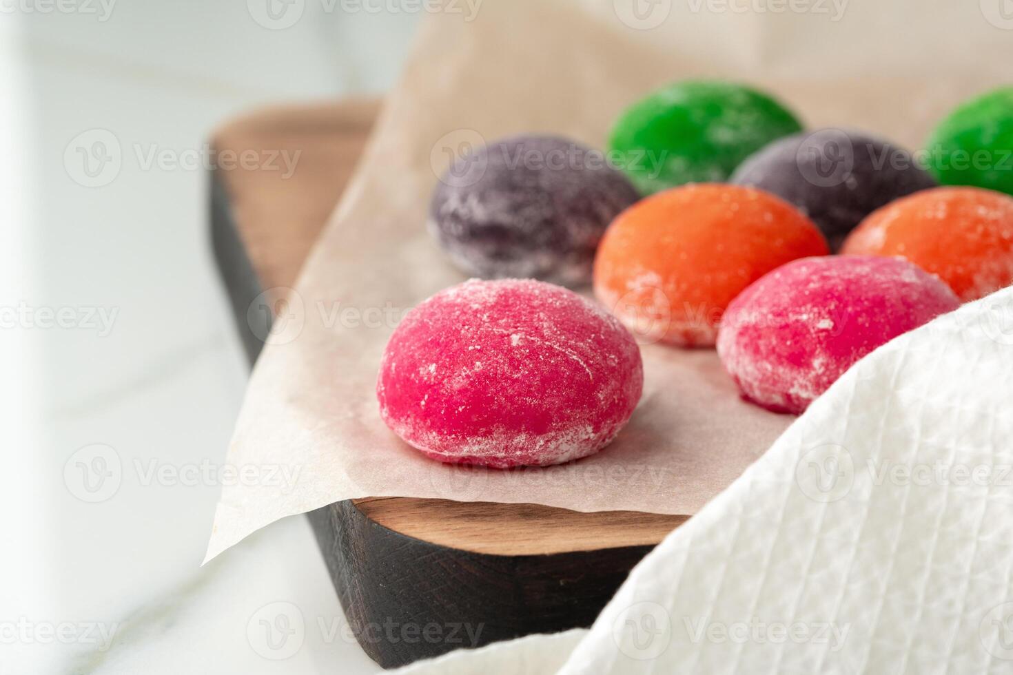 Multi-colored Japanese cakes Mochi in a white plate photo