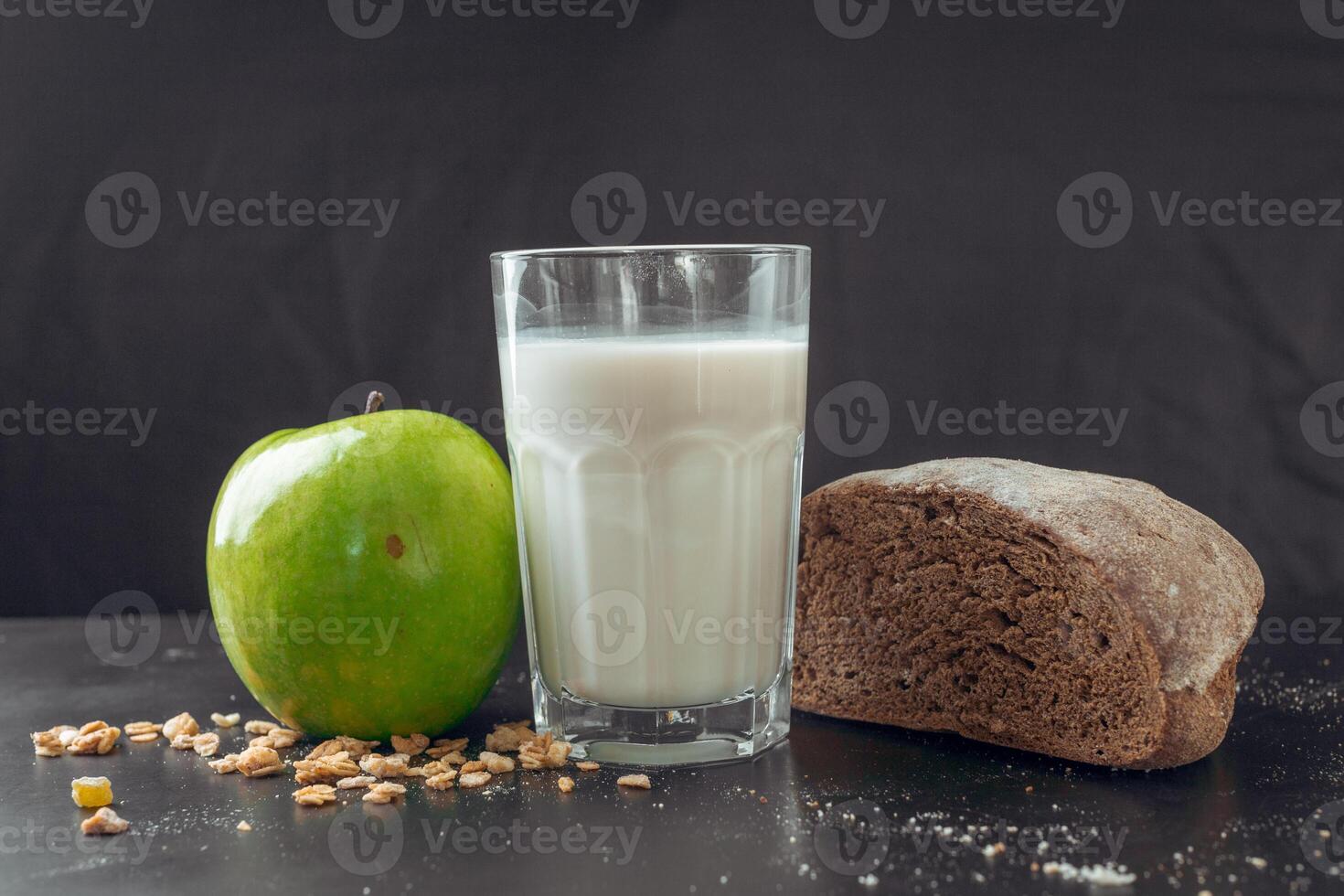glass of milk and bread photo