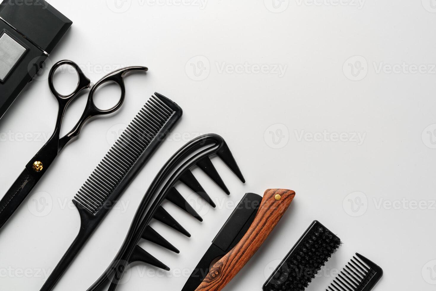 Set of barber tools for haircut on gray background flat lay photo