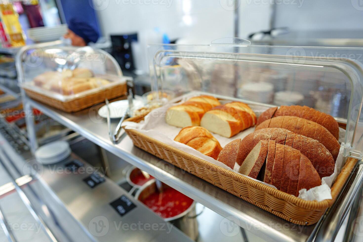 Freshly Baked Bread Loaves Displayed in a Basket at a Local Bakery Shop photo