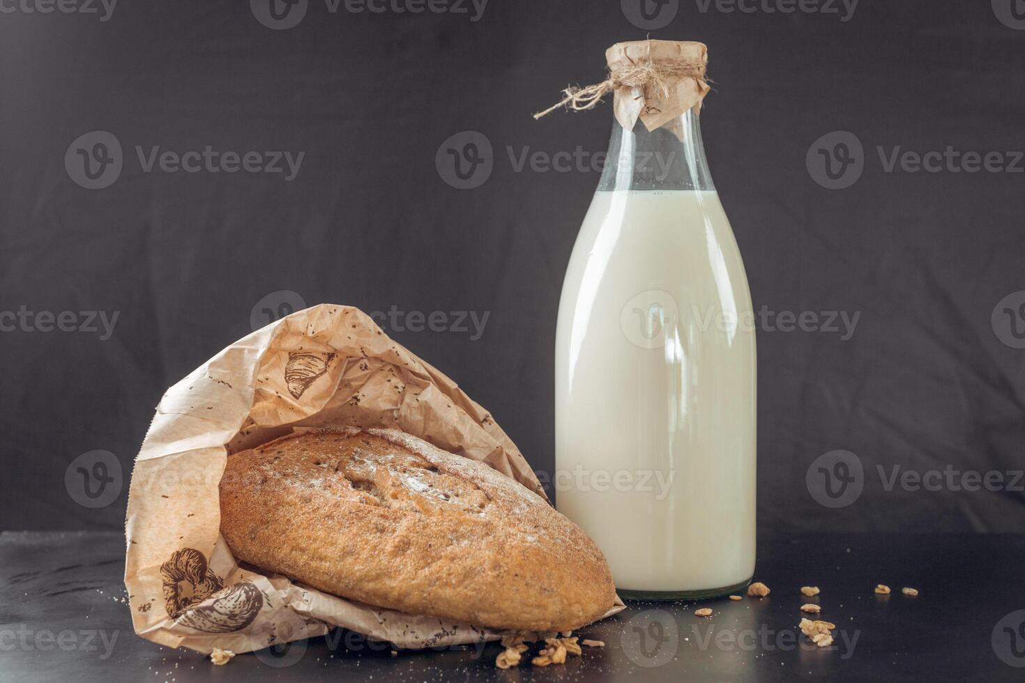 glass of milk and bread photo