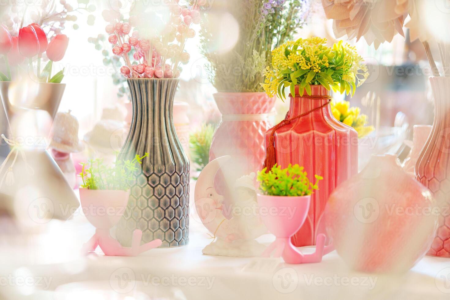 Vibrant Bouquets in Eclectic Vases on a Sunlit Table at a Springtime Event photo