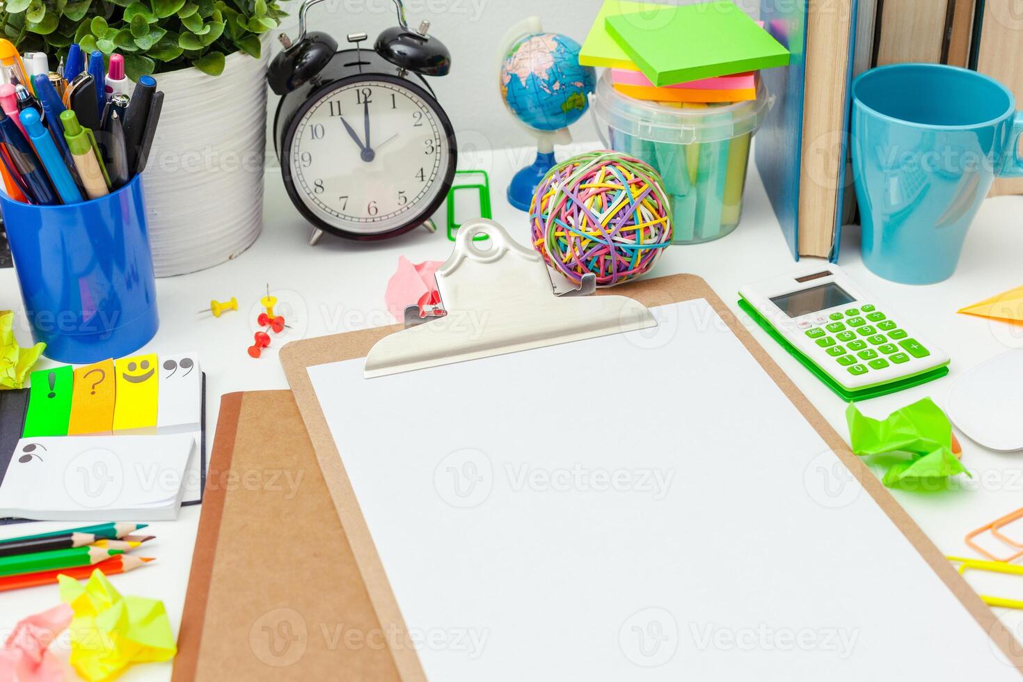 Work place of a creative person with a variety of colorful stationery objects photo