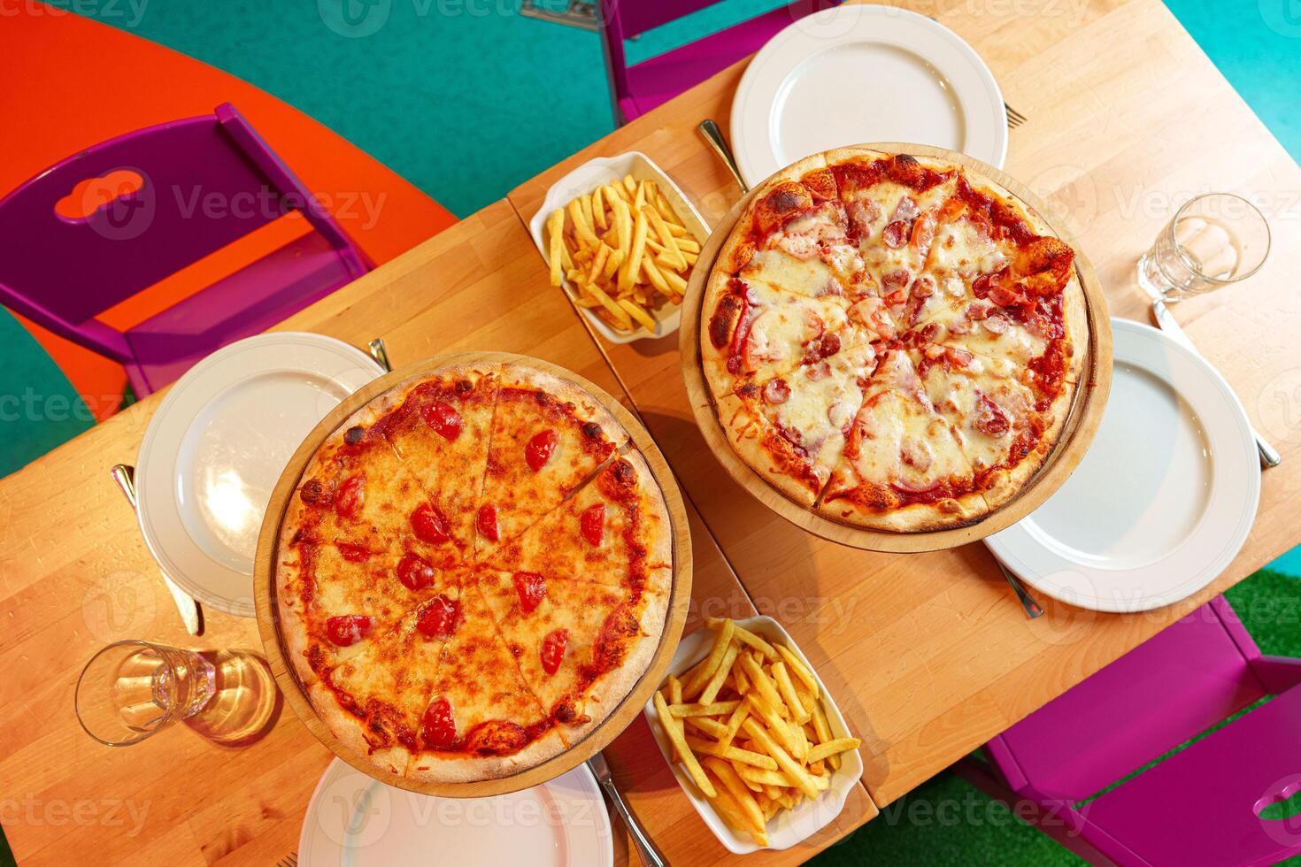 Freshly Baked Pizzas Served on Wooden Stands at an Outdoor Party Setting photo