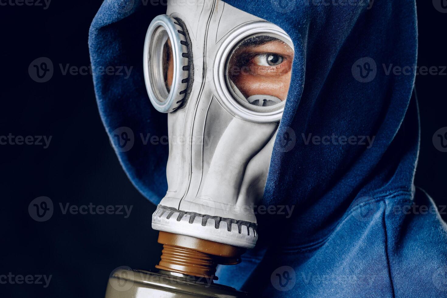 Portrait of a man in a gas mask. Panic during quarantine. Coronavirus pandemia photo
