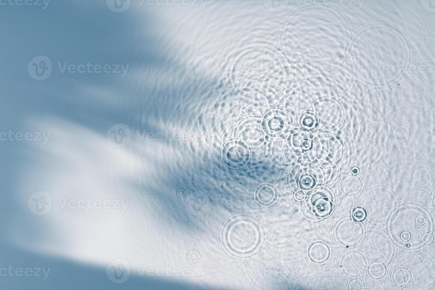 Clear turquoise pool water glistens under sunlight with gentle ripples photo