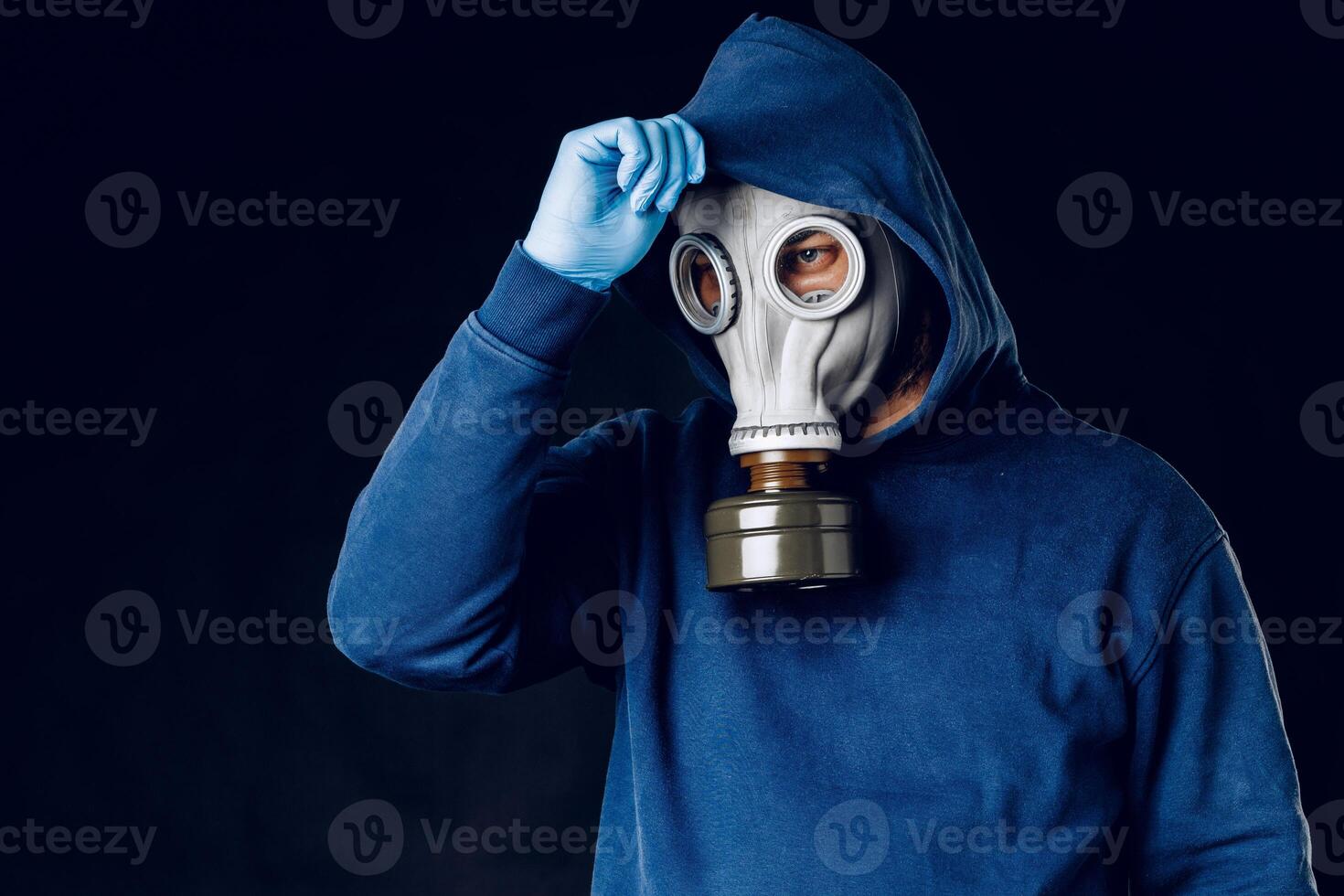 Portrait of a man in a gas mask. Panic during quarantine. Coronavirus pandemia photo