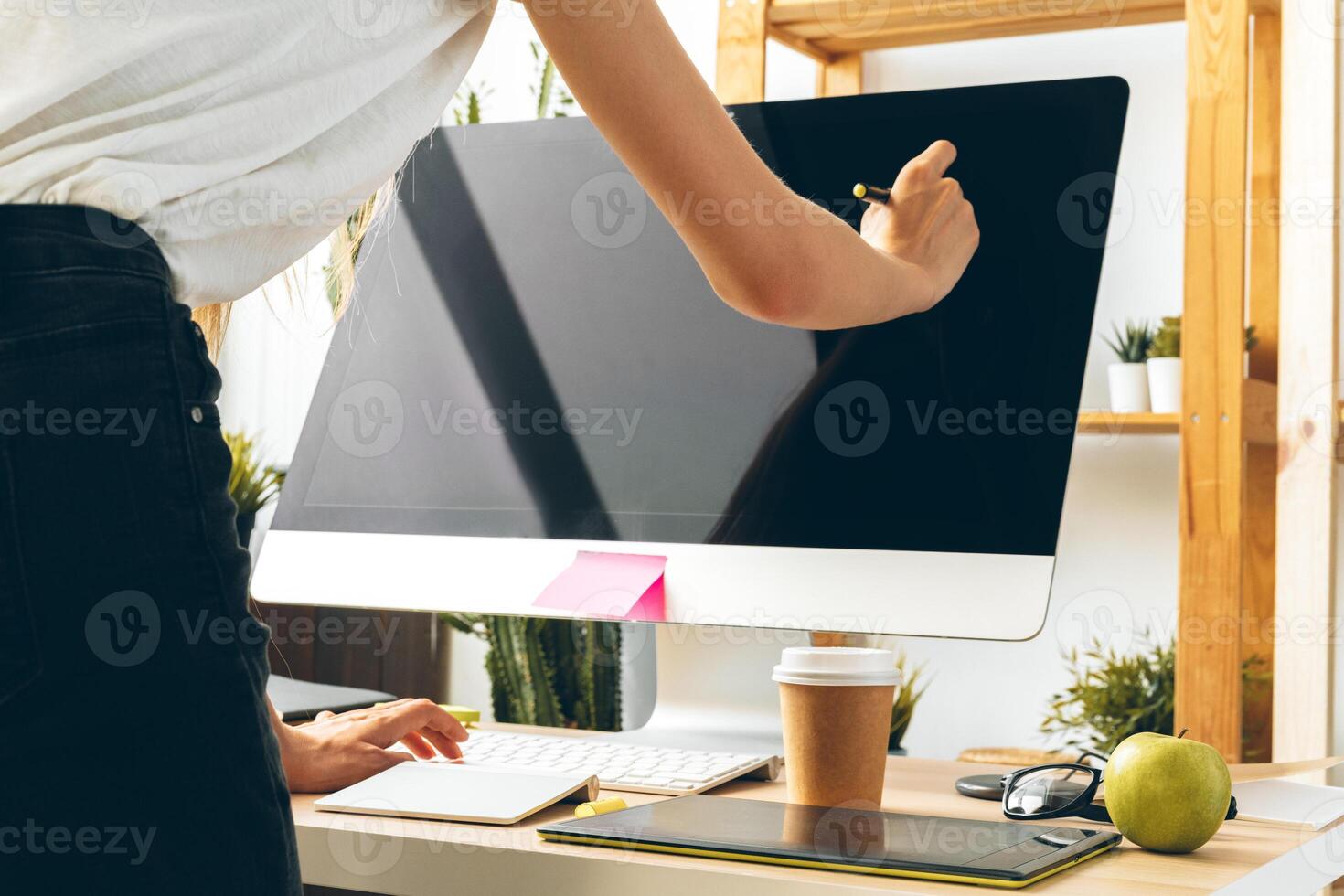 Young woman and tablet working at home office. Stay safe and working from home. photo